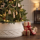 Cream knit tree collar around a decorated Christmas tree