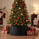Black woven tree collar around a decorated tree