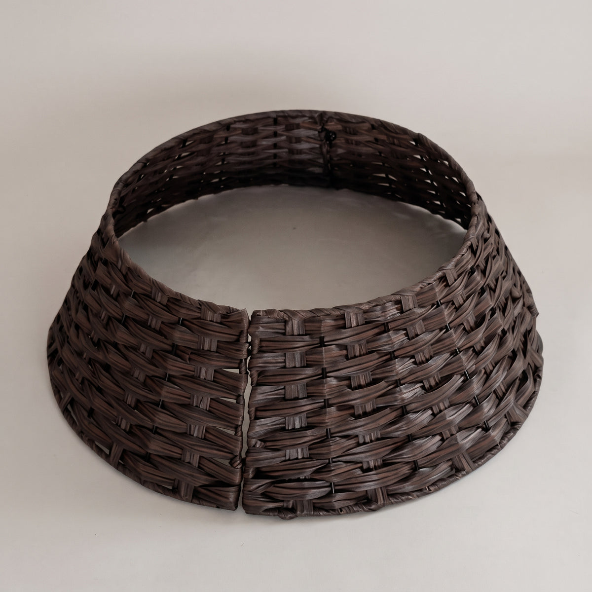 Coffee brown woven rattan tree collar, studio photo