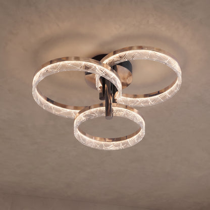 Corvina ceiling light close-up with 3 crystal-textured rings