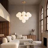 Solenne Pendant 13-light cluster in a warm double-height living room