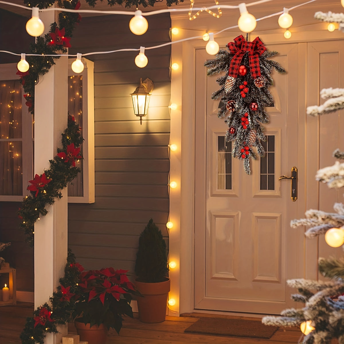 Artificial Christmas teardrop swag in green pine with cones and red berry clusters