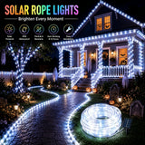 39.4 ft solar string light run wrapped around a garden tree