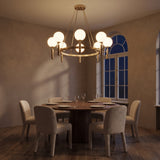 Solenne brass chandelier at night — lights on