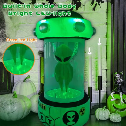 8-foot green alien Halloween inflatable glowing inside a capsule-style display