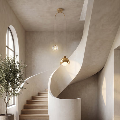 Noor dual pendant light in a curved stairwell