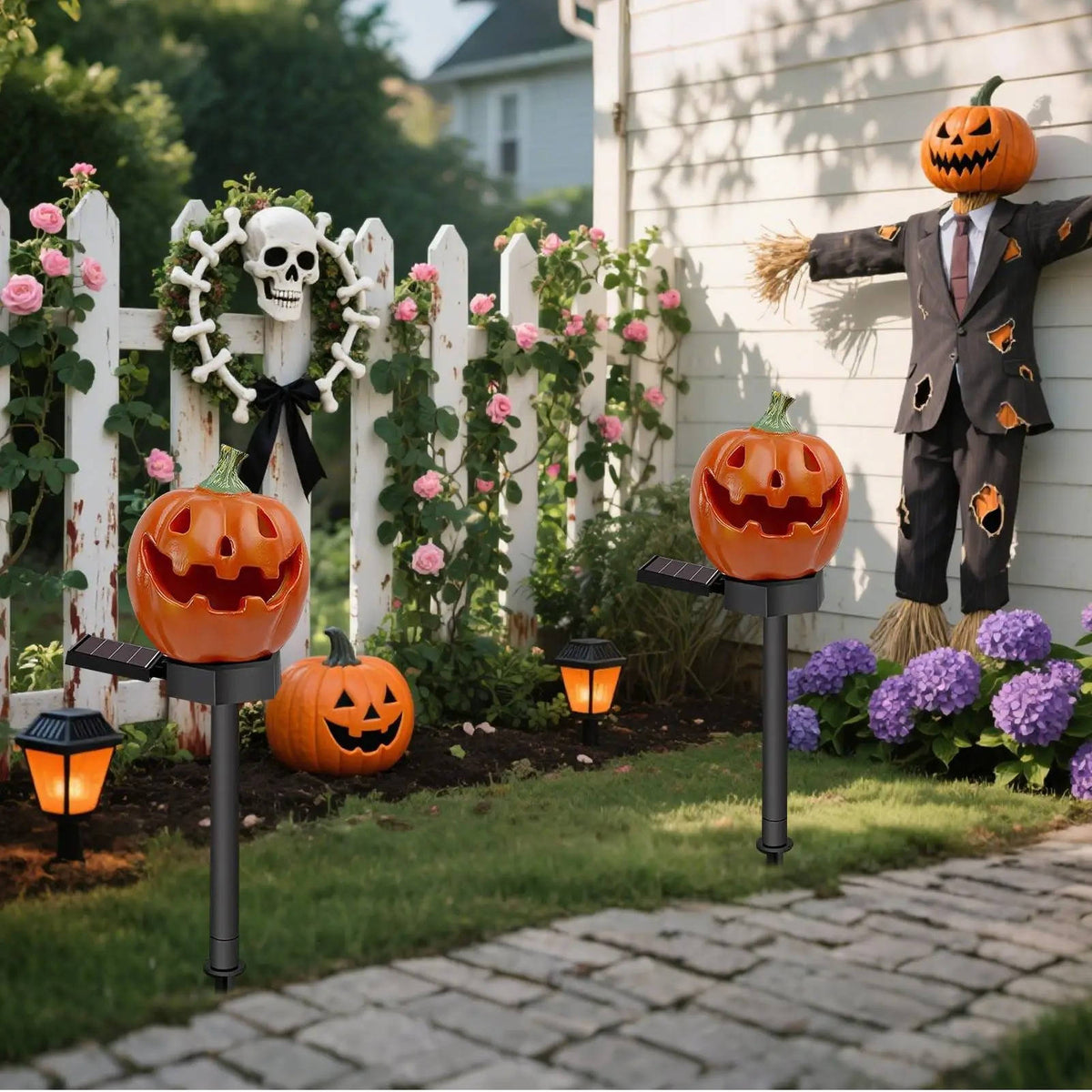 Set of solar pumpkin lights lining a driveway