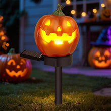 Close-up of a solar pumpkin light with warm white glow