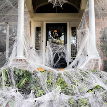 200 sqft stretchable spider web Halloween decoration draped over a porch entrance