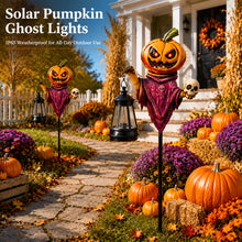 Solar pumpkin scarecrow garden stake with a hanging warm LED lantern lit at night