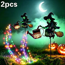 Witch riding a broom solar lantern shown in warm white light