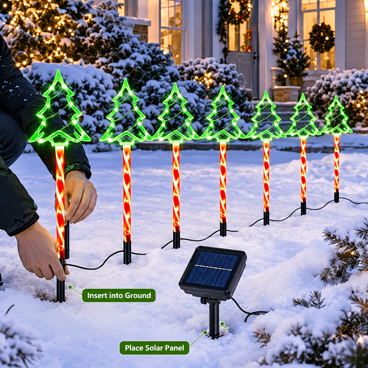 Christmas tree stake lights spaced along a driveway approach