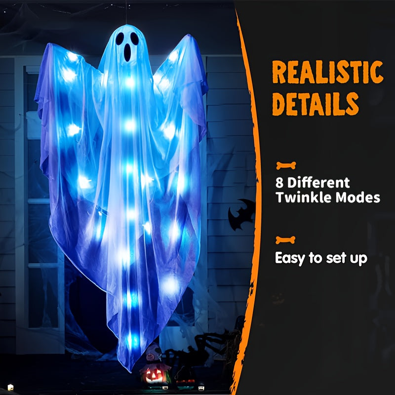 Hanging ghost decoration glowing at night on porch