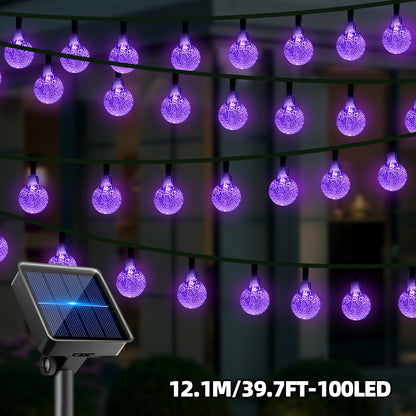Purple LED solar bubble ball string lights wrapped around an outdoor tree - view 5