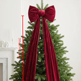 Long tailed red velvet bow for a fireplace, staircase or window