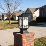 Elmwood lattice glass post light on a brick driveway pillar on a clear late-autumn day