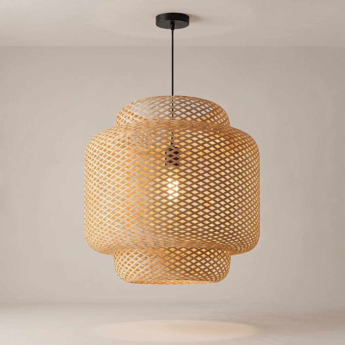 Maren woven bamboo pendant on a grey studio background