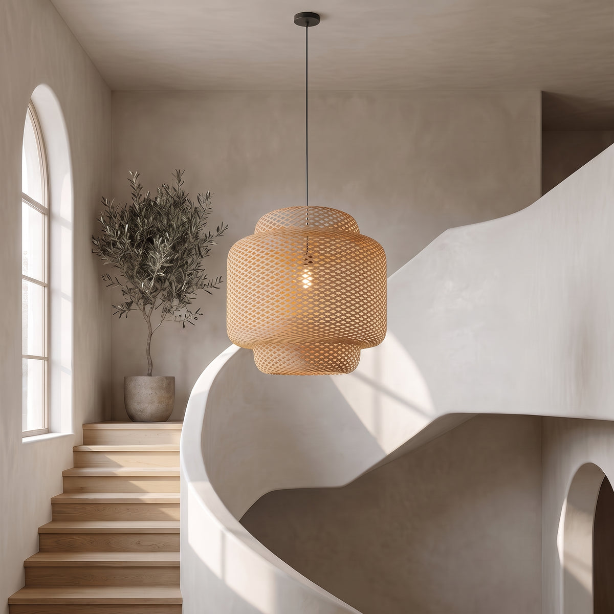 Maren woven bamboo pendant in a curved stairwell