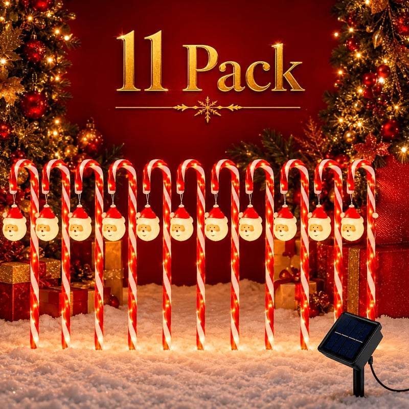 Warm LED candy cane pathway lights marking a driveway edge