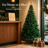 Green artificial Christmas tree shown undecorated against a plain background