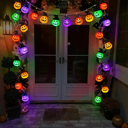 Multicolor pumpkin bead string light strand coiled on a white background