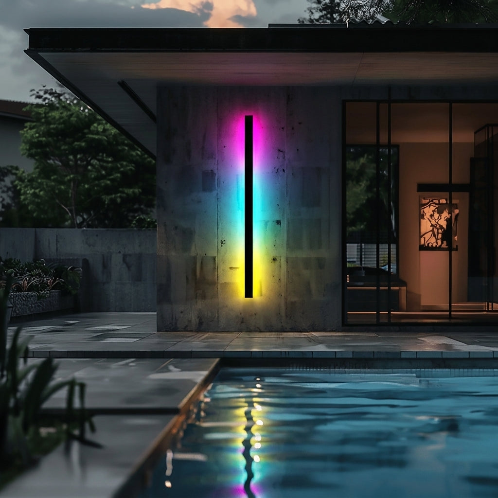 Fenja RGB Smart outdoor wall sconce beside home pool, colorful glow