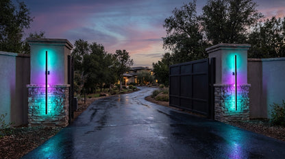 Fenja RGB Smart outdoor wall sconces flanking large estate gate