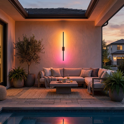 Fenja RGB Smart outdoor wall sconce on covered patio, warm RGB glow