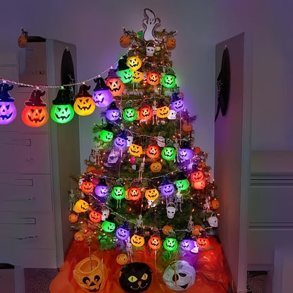 Close-up of an illuminated pumpkin bead on the string light