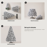 Assembly guide: unfold the stand, stack the sections, fluff the branches