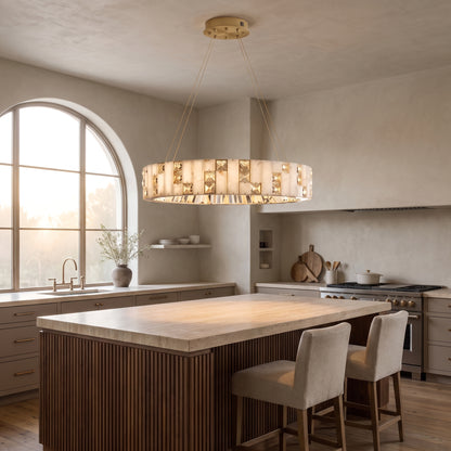 Halcyon alabaster and gold ring chandelier above a walnut kitchen island