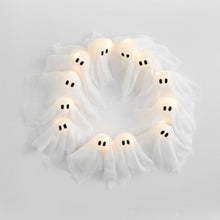 Close-up of one of the twelve ghost-shaped LED lights on the Halloween wreath