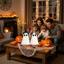 Two-piece white ghost figurine Halloween set displayed on a shelf