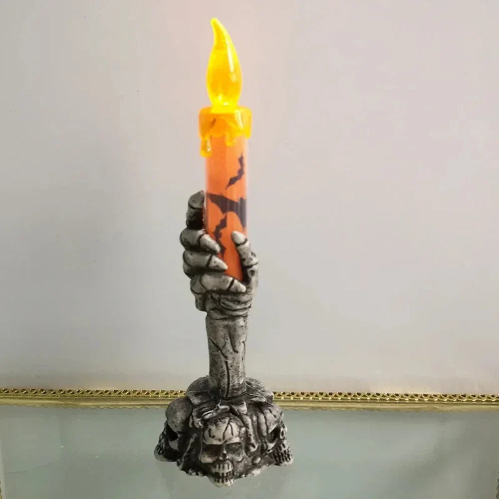 Skull candle holder in orange and green color options