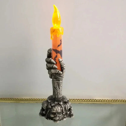 Skull candle holder in orange and green color options