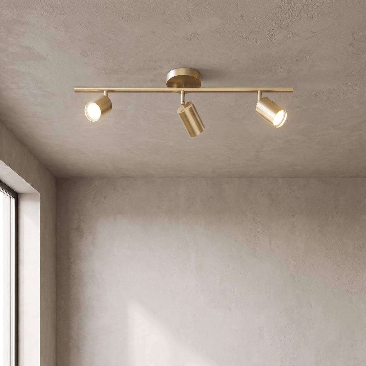 Casimir track light in brushed gold with 3 lights