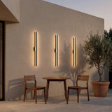 Haylen linear LED wall light on a covered patio wall