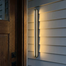 Haylen Solar outdoor wall sconce at upscale entryway