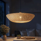 Amara bamboo chandelier at night — lights on