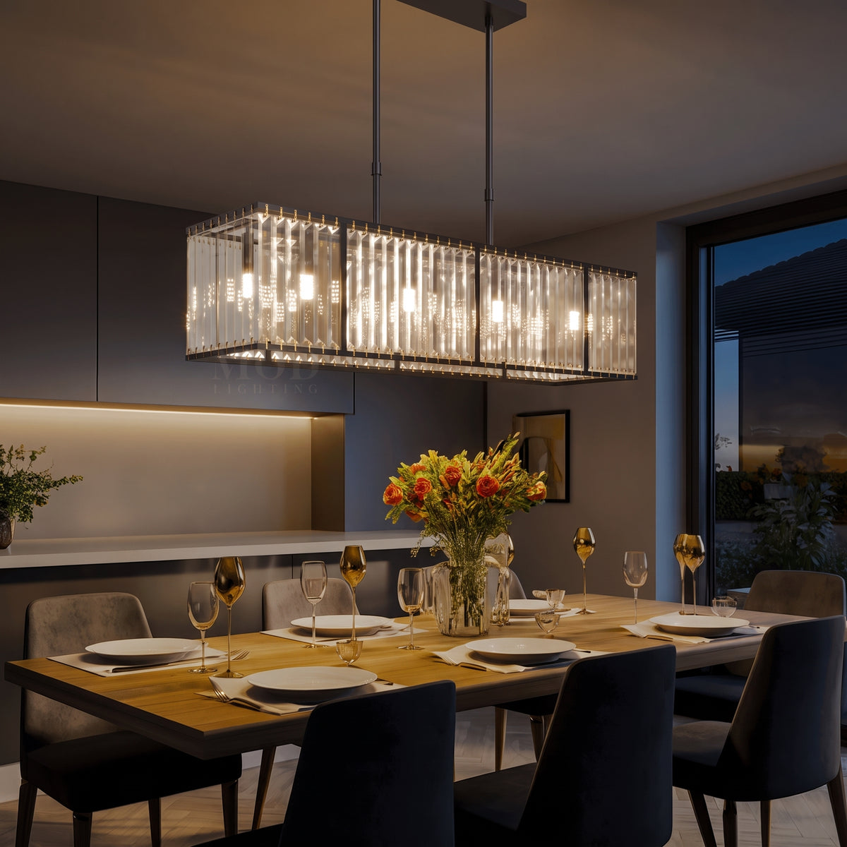 Celestine linear chandelier at night — lights on