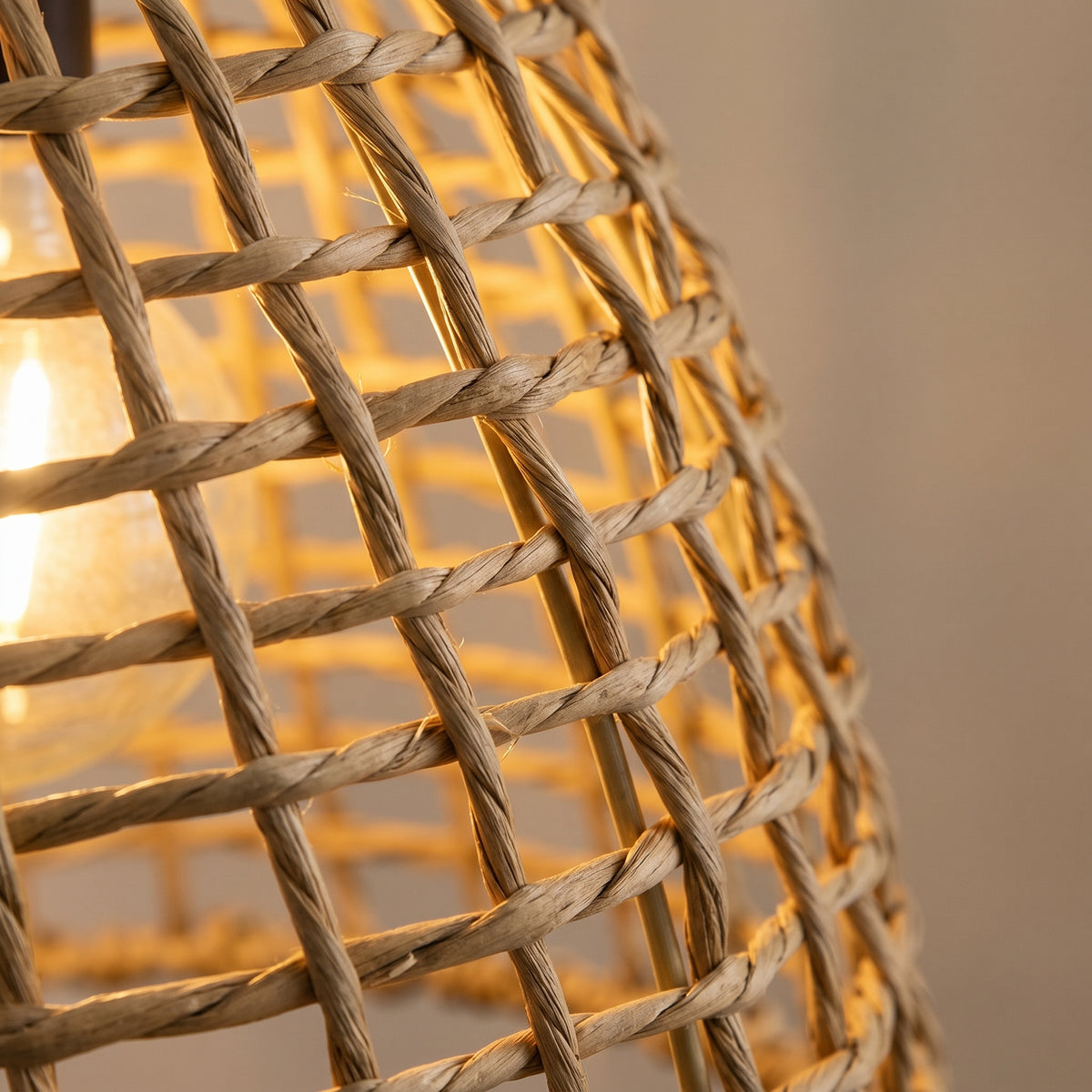 Close-up of the hand-woven rattan weave with warm glow