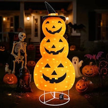 Light-up Halloween pumpkin decoration glowing outdoors at night