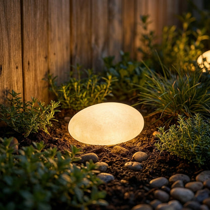 Ishi - glowing among garden plants at night
