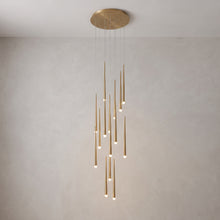 Full cascading chandelier shown against a plain grey studio background