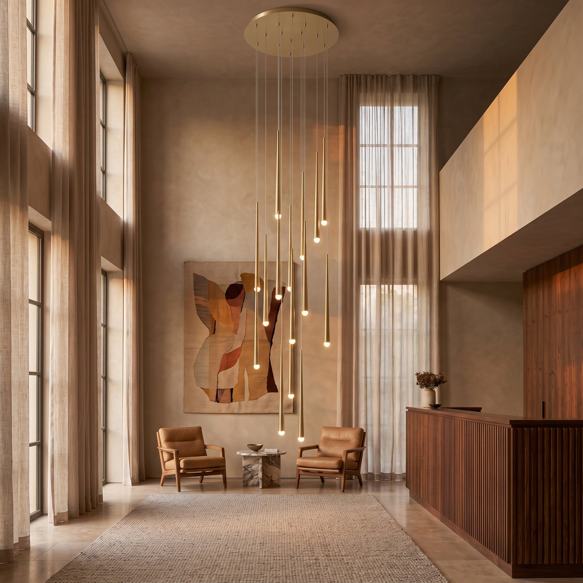 Cascading chandelier in a boutique hotel lobby with a high ceiling