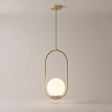 Opaline pendant in brushed gold on a grey studio background