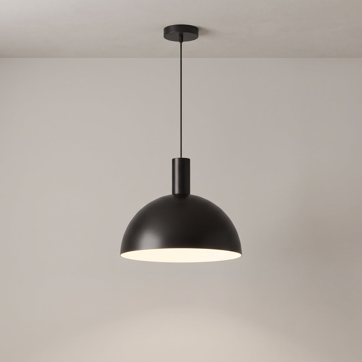 Isolde dome pendant light in matte black on a grey studio background