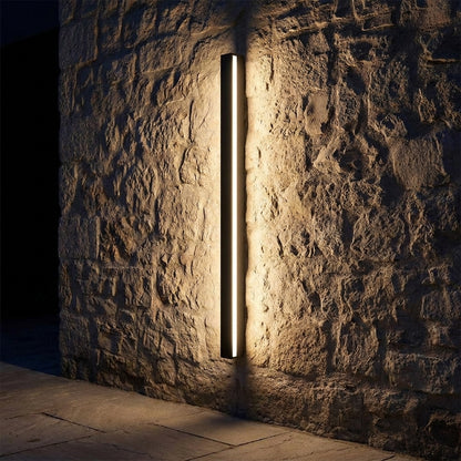 Kuro - mounted on stone wall at night