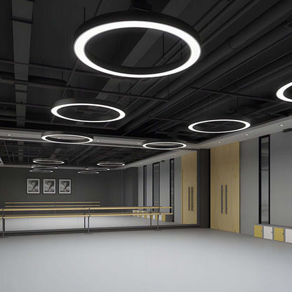 LED ring pendant light illuminated in a commercial office
