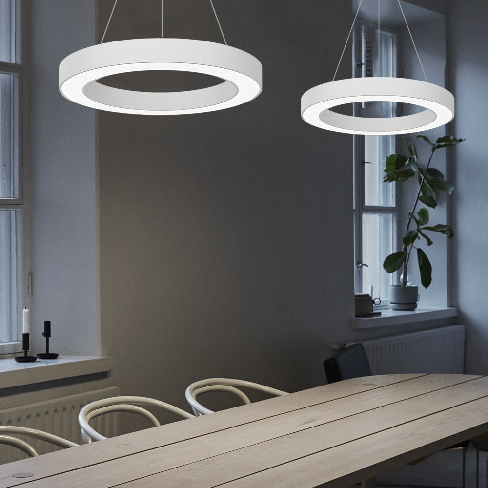 LED ring pendant light mounted above a study desk